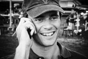 man-talking-on-cell-phone-baseball-cap