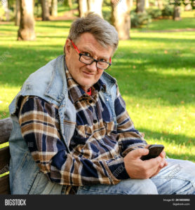 middle-aged-man-with-cell-phone-outdoors.